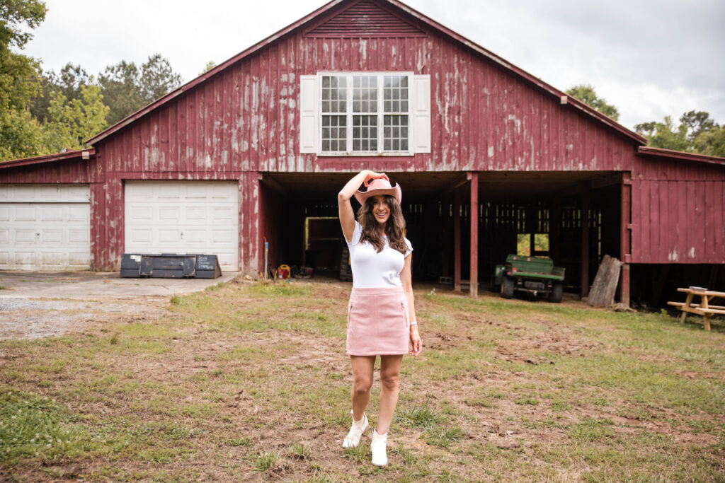 About how Corinne left Corporate pink hat and a barn